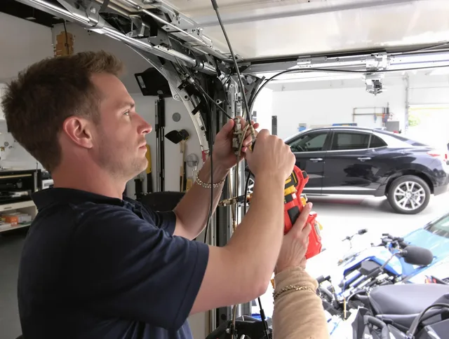 Kingston Garage Door Repair safety certified technician performing cable replacement in Kingston