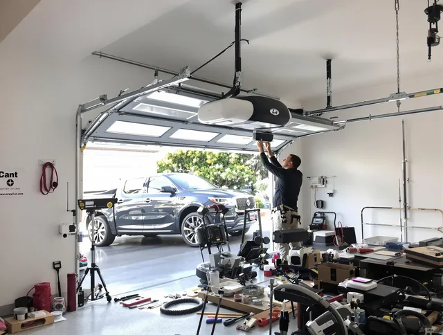 Kingston Garage Door Repair specialist installing smart garage door opener system in Kingston home