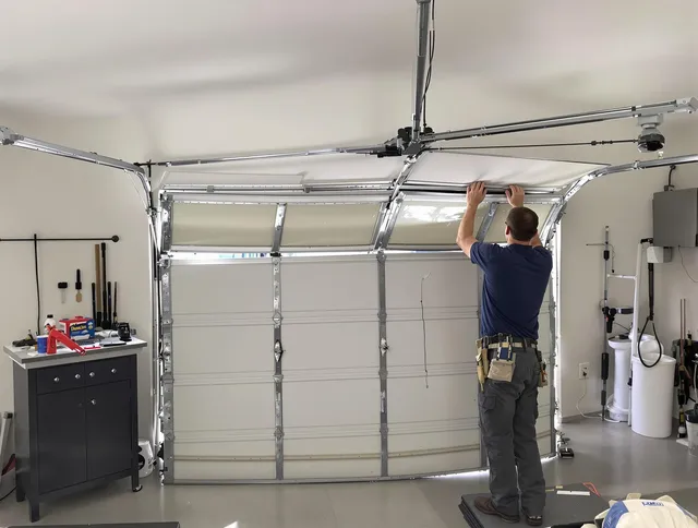 Kingston Garage Door Repair specialist performing precise section replacement on Kingston garage door